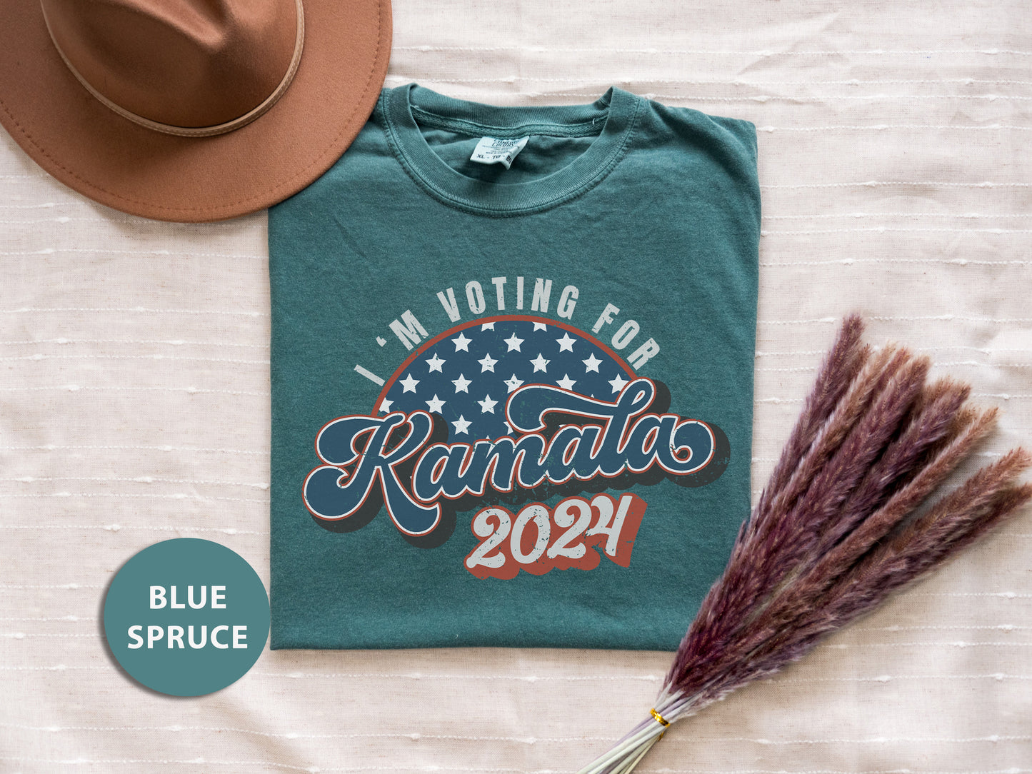 a t - shirt that says i'm voting for kansas with a straw and