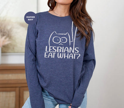 a woman wearing a sweatshirt that says lesbians eat what?