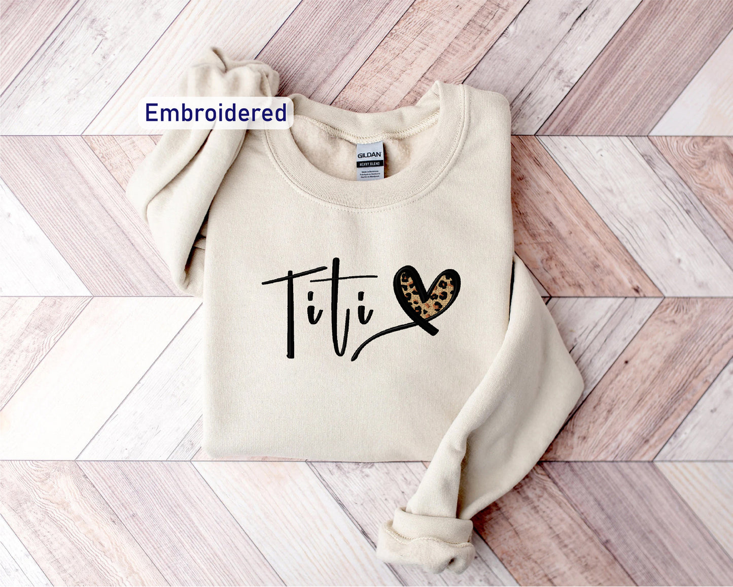 a sweater with the word titi written on it