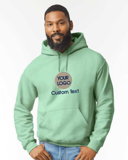 a man with a beard wearing a green hoodie