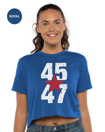 a woman wearing a blue crop top with a red star on it