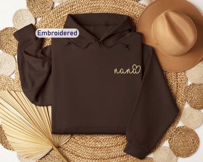 a brown hoodie with embroidered name on it