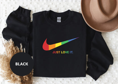 a black shirt with a rainbow nike logo on it