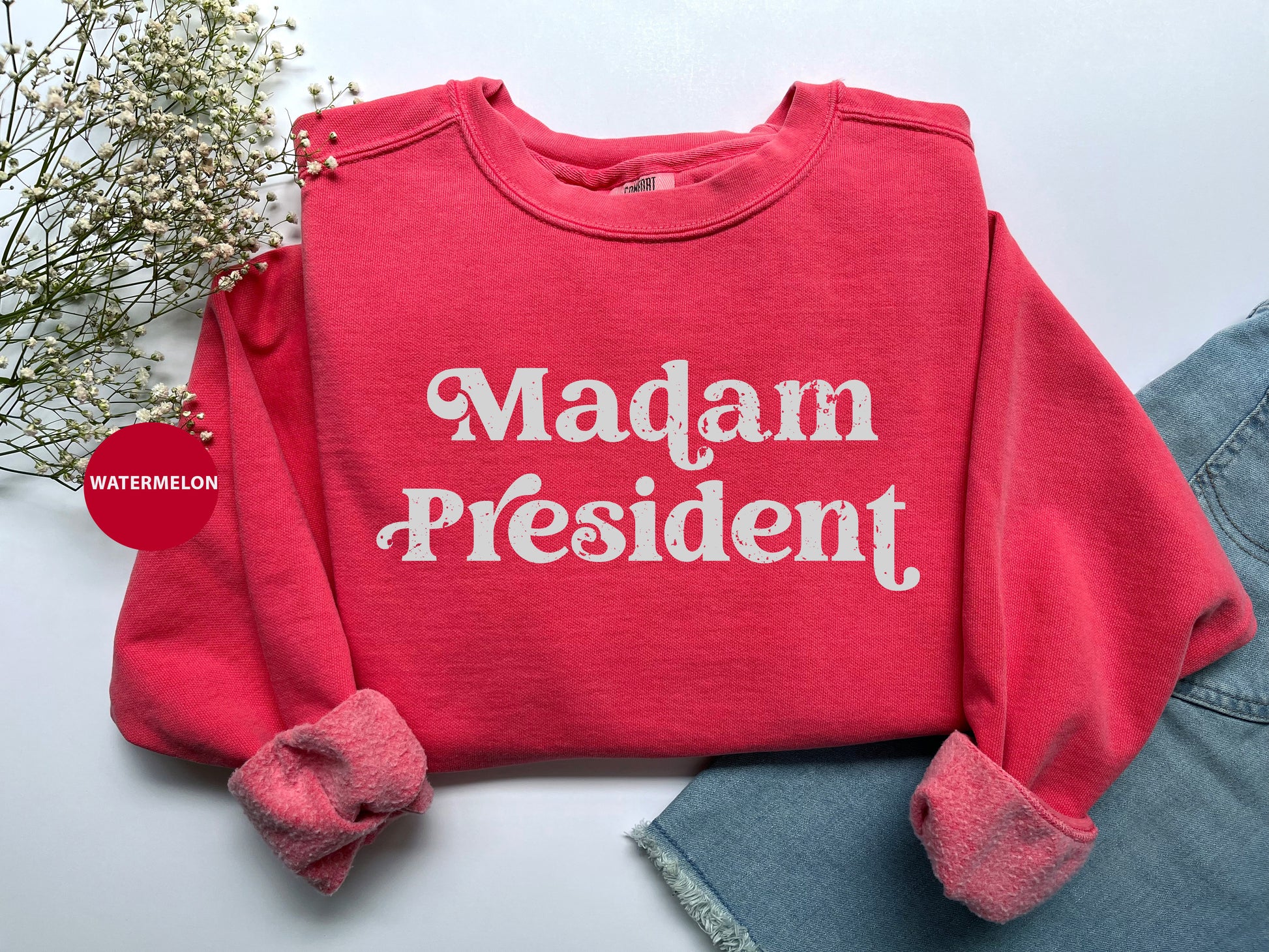 a red sweatshirt with the words madam president on it