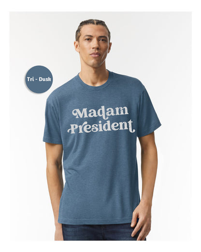 a man wearing a t - shirt that says madam president