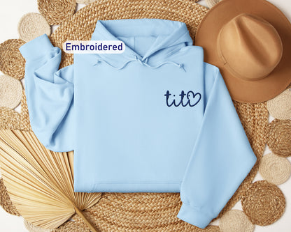 a blue hoodie with the word tito written on it