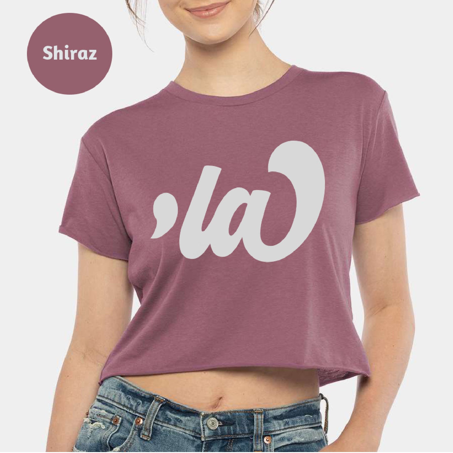 a women's crop top with the word la on it