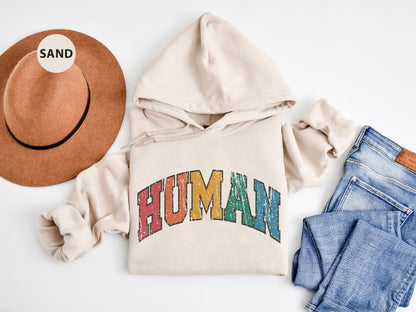 a white hoodie with the word human on it