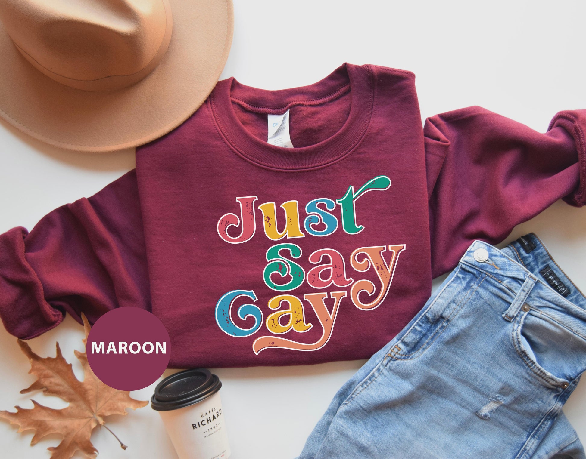 a maroon shirt that says just say gay on it