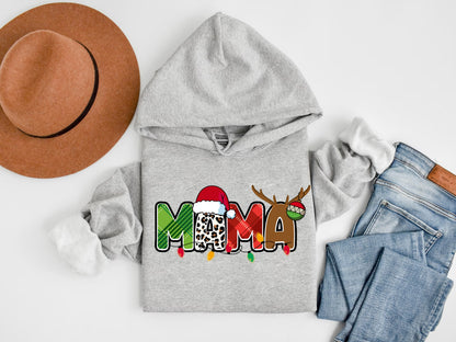 A gray hoodie with the word "MAMA" printed on it, along with a brown hat and a pair of jeans, all laid out on a white background.