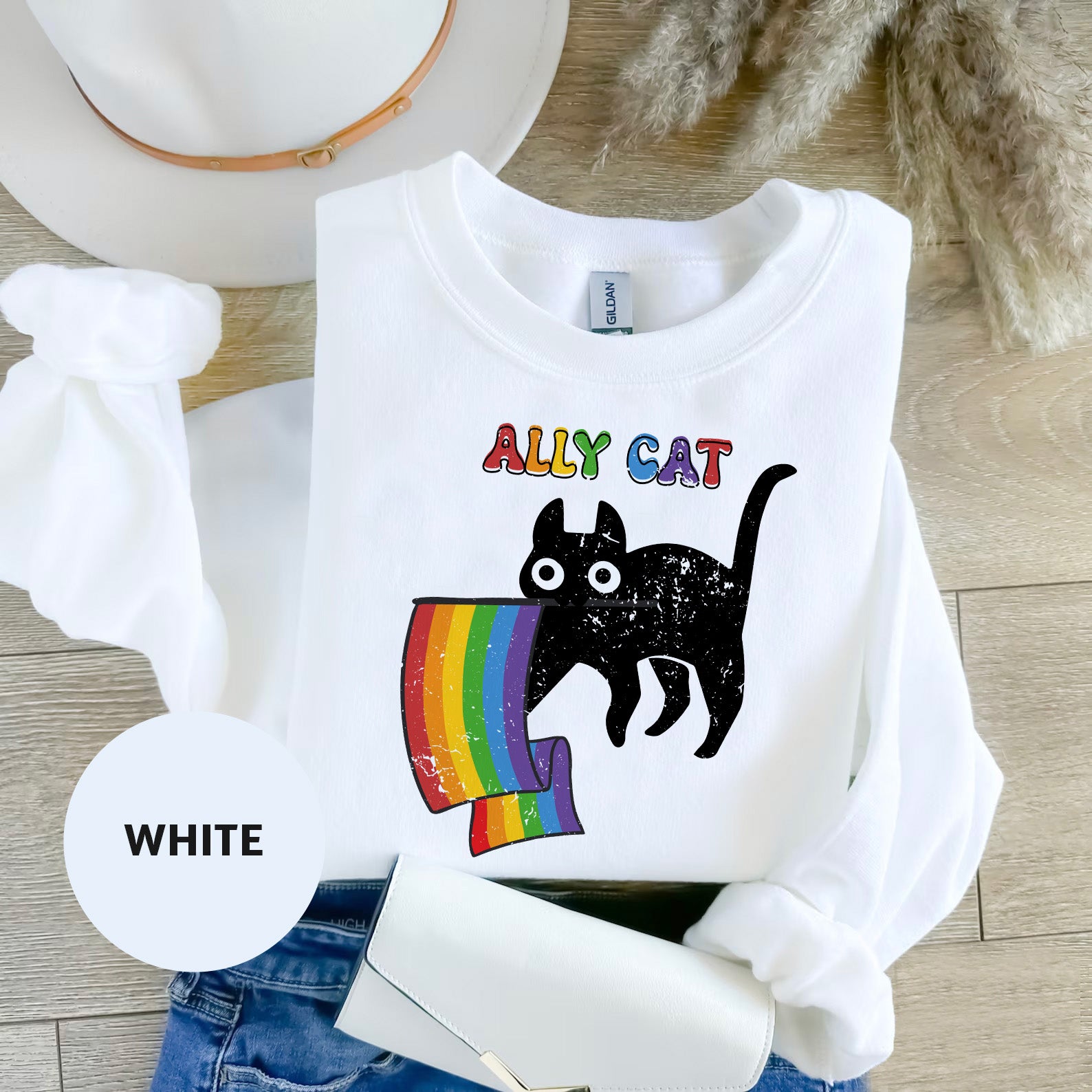 a white shirt with a black cat on it