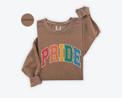 a brown sweatshirt with the word pride printed on it