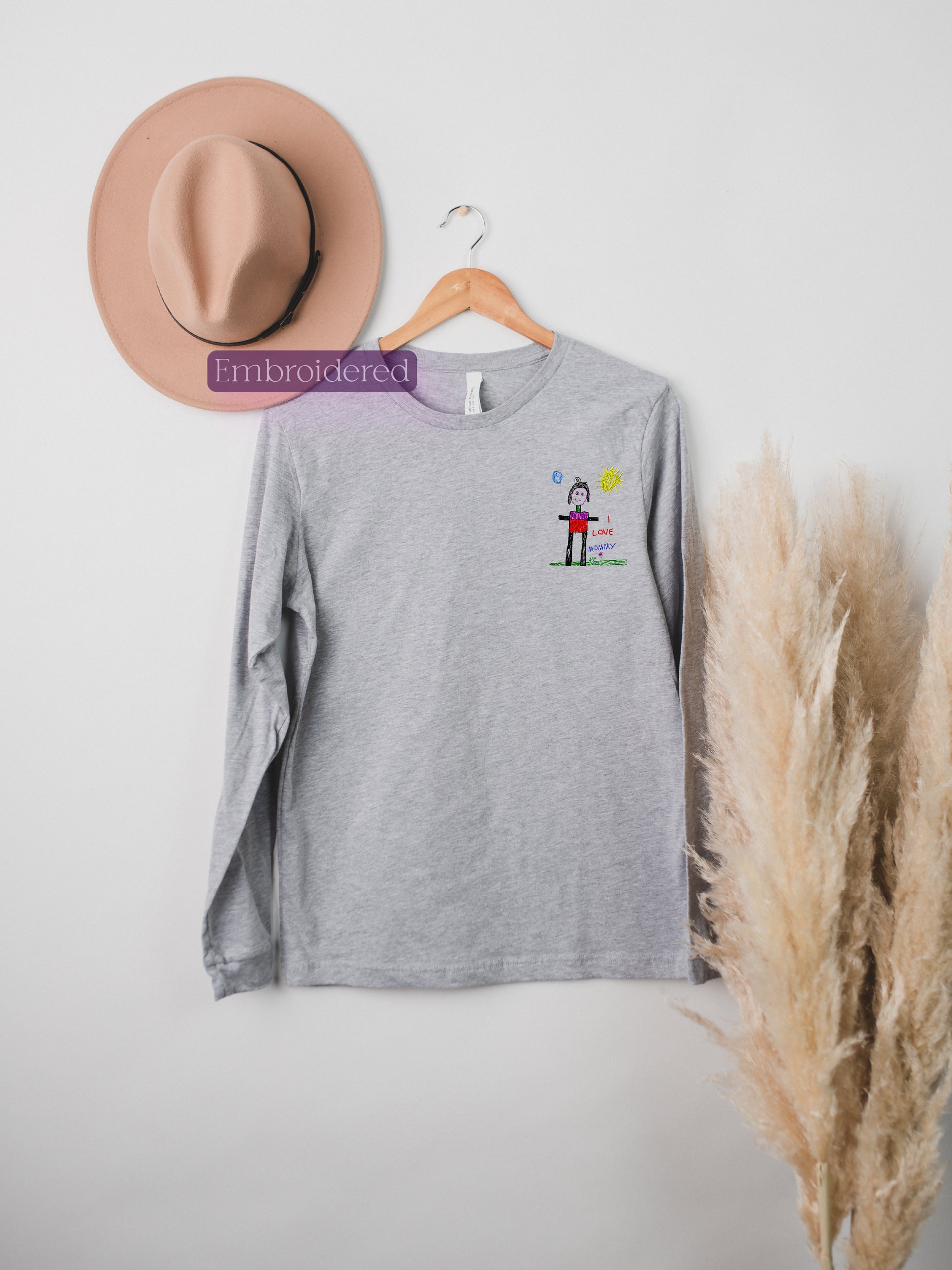 a hat and a t - shirt hanging on a wall