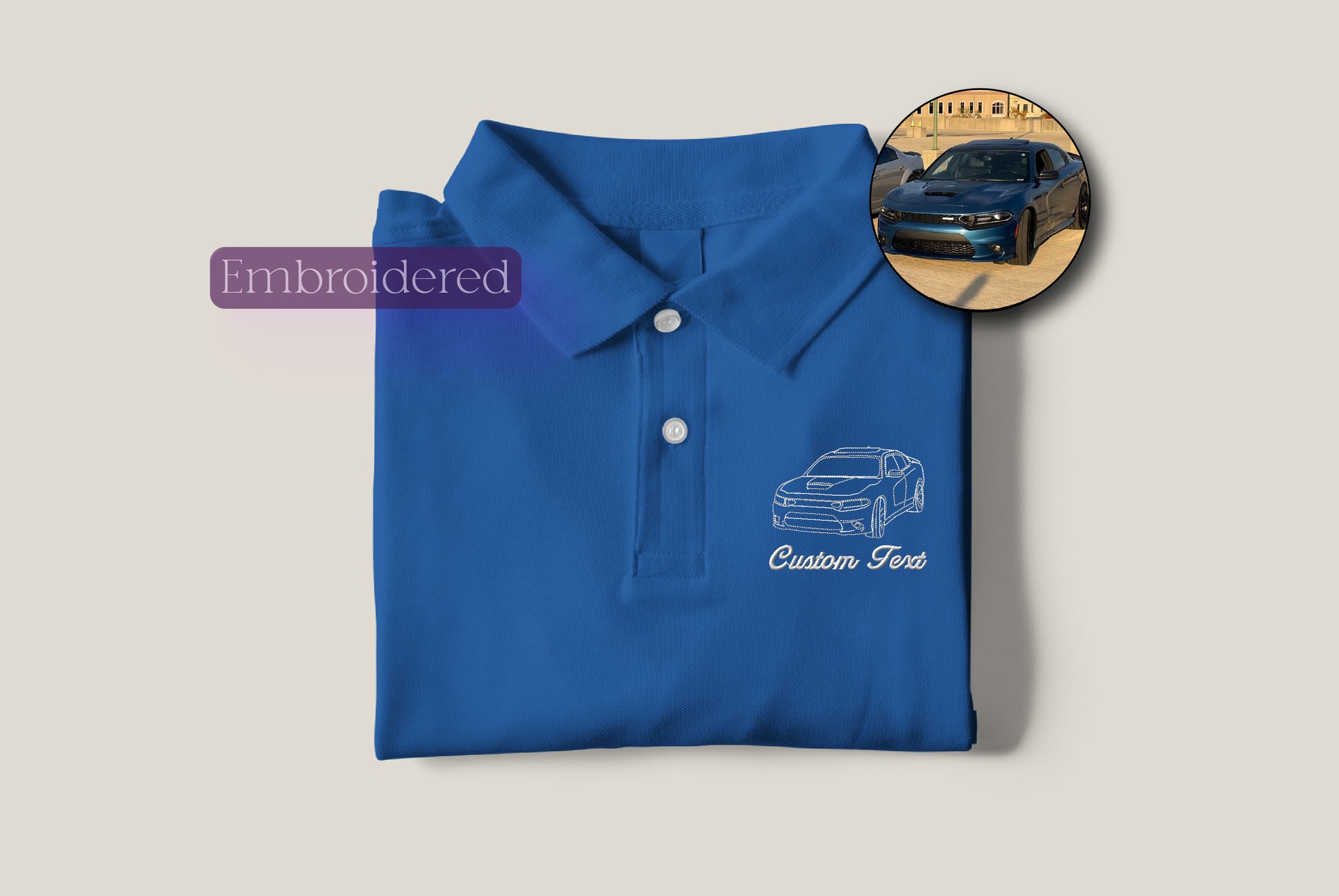 a blue polo shirt with a picture of a car on it