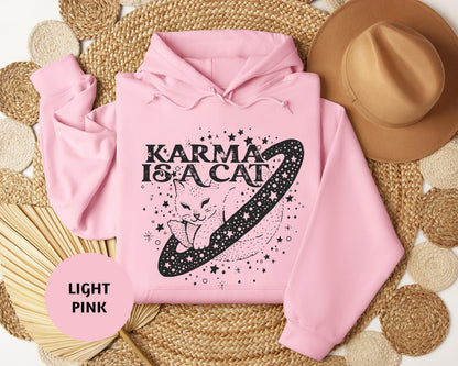 a pink hoodie with a graphic of a cat on it