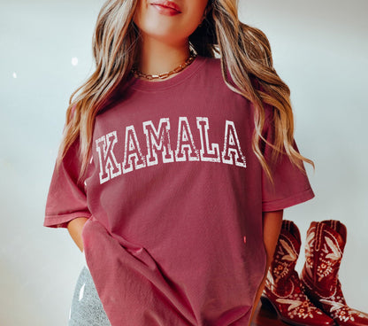 a woman wearing a red shirt with the word kalamala on it