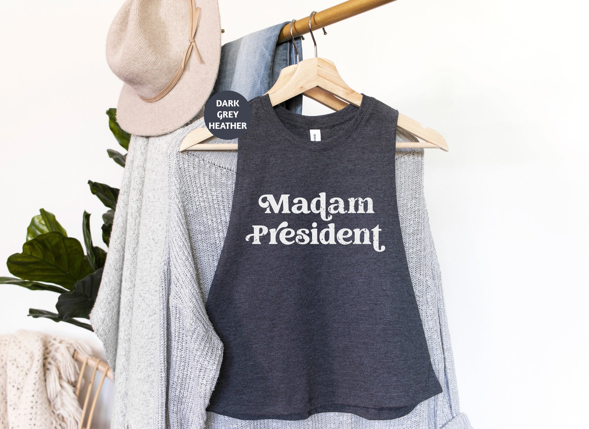 a t - shirt that says madam president hanging on a rack