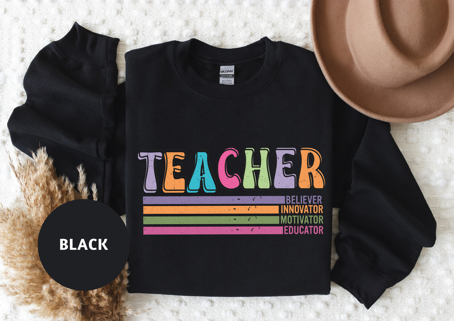 a black shirt with a rainbow teacher on it