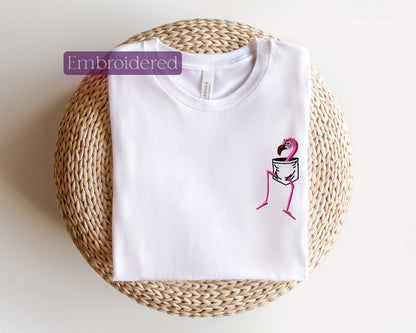 a white t - shirt with a picture of a woman holding a glass of wine