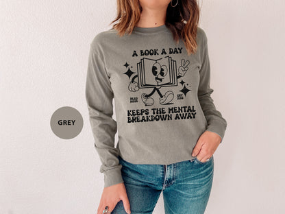 a woman wearing a book a day shirt