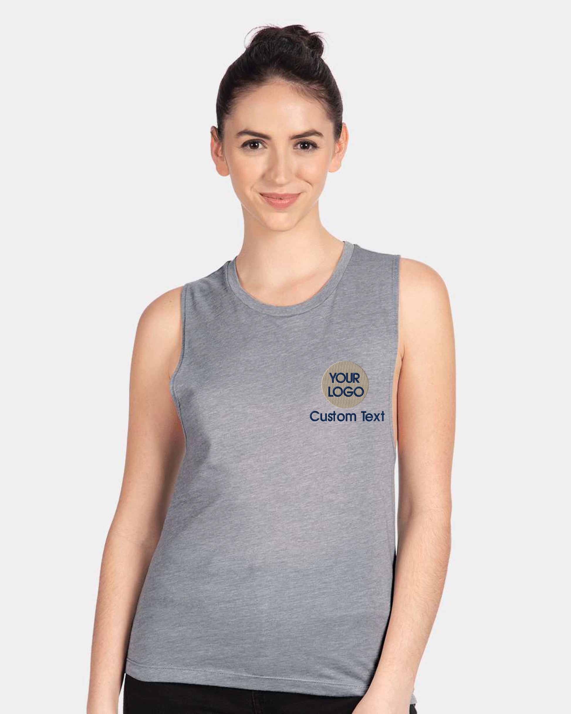 a woman wearing a grey tank top with the words your dogs on it