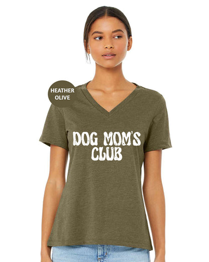 a woman wearing a t - shirt that says dog mom's club