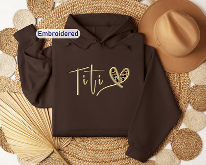 a brown hoodie with the word titi written on it