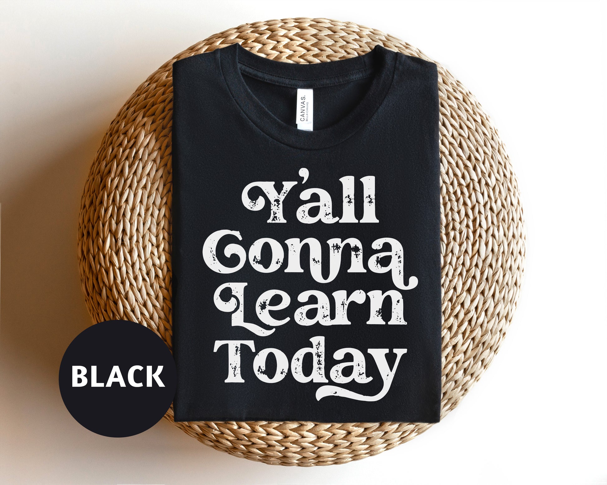 a black t - shirt that says y'all conna learn today on it