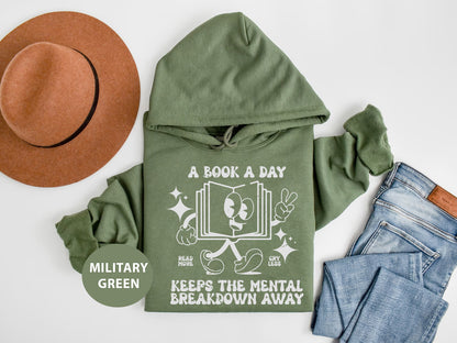 a green hoodie with a book a day on it