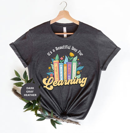 a t - shirt that says it's a beautiful day to be learning