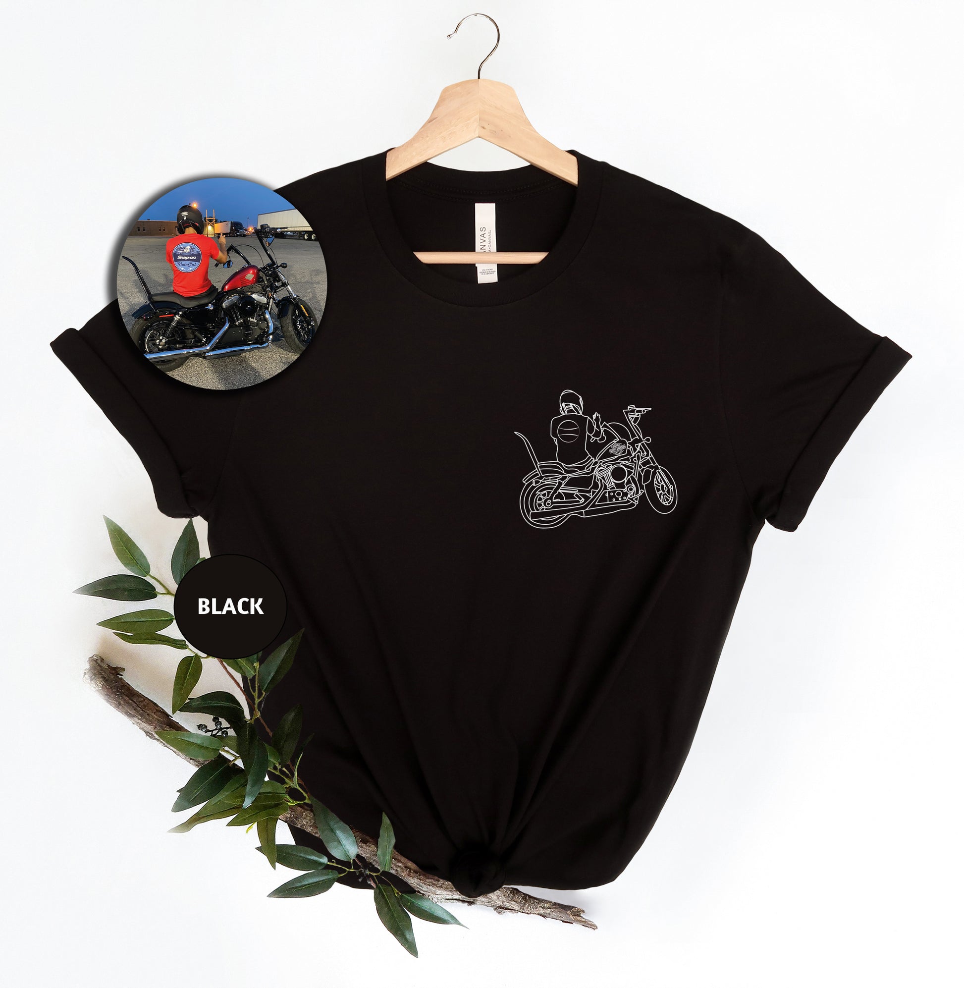 a black shirt with a picture of a man riding a motorcycle