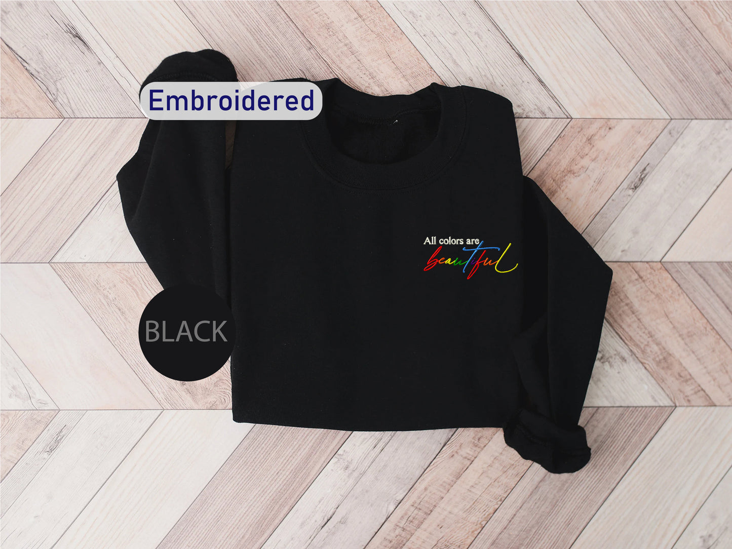 a black sweatshirt with the words embroidered on it