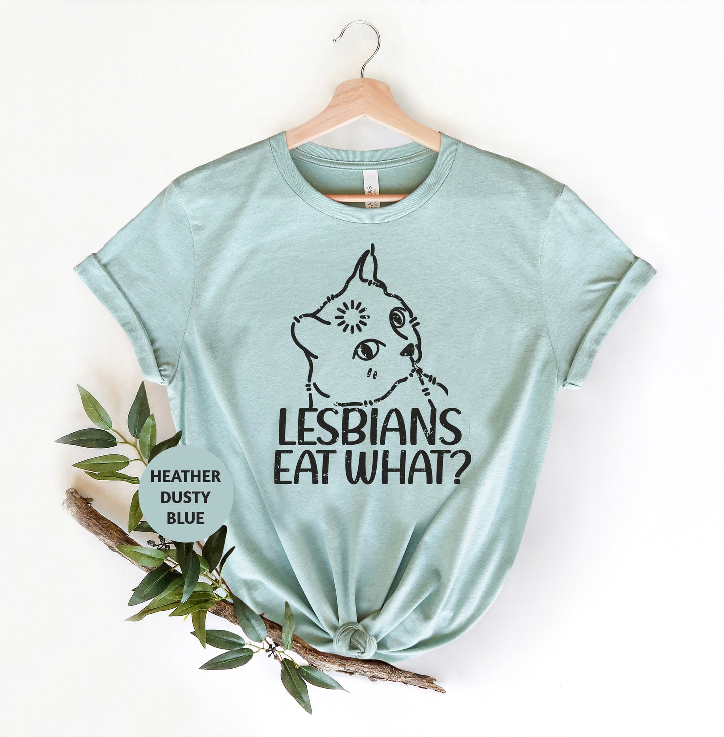 a t - shirt that says lesbians eat what? with a picture of a