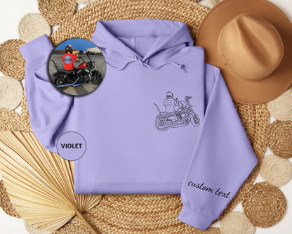 a purple hoodie with a picture of a man on a motorcycle