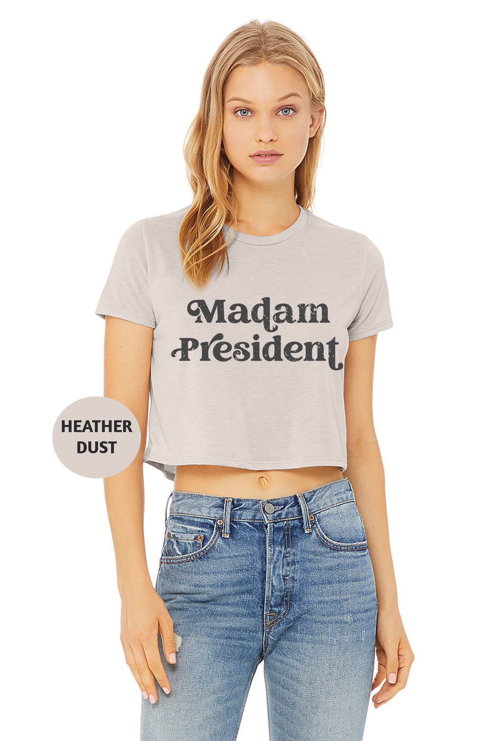 a woman wearing a crop top that says madam president