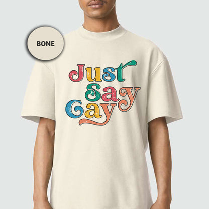 a man wearing a white t - shirt that says just gay