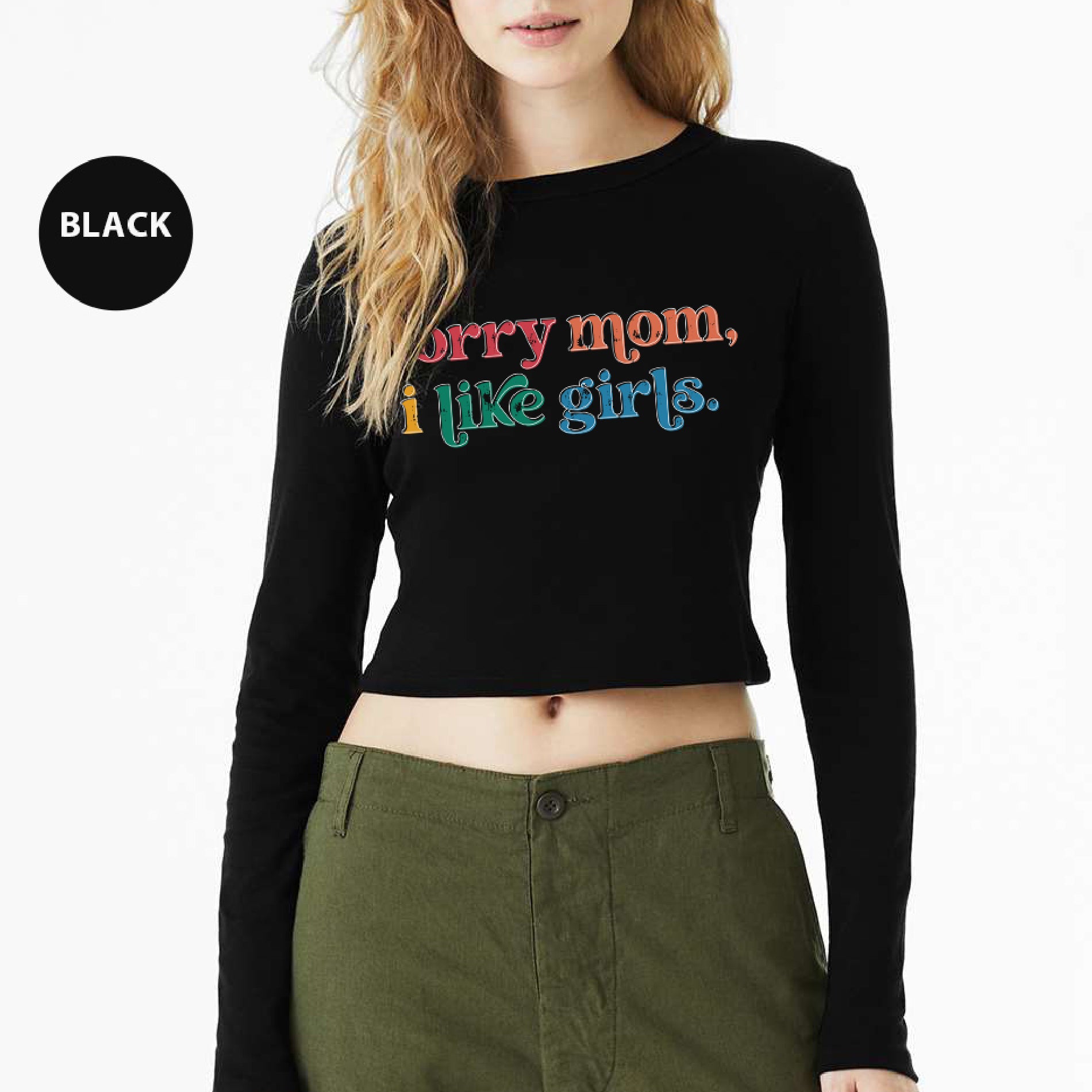 a woman wearing a black crop top that says sorry mom, i like girls