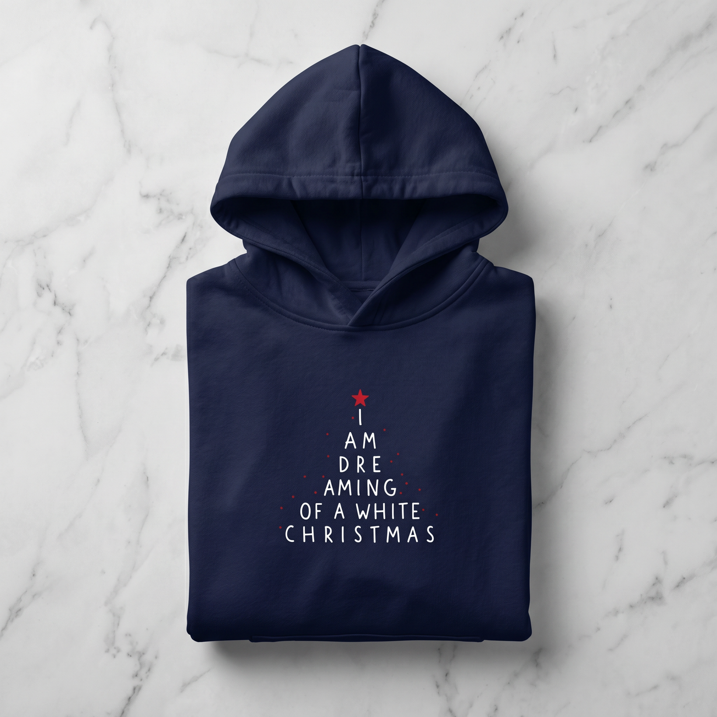 A navy blue hoodie with white text printed on it, laid out on a marble surface.