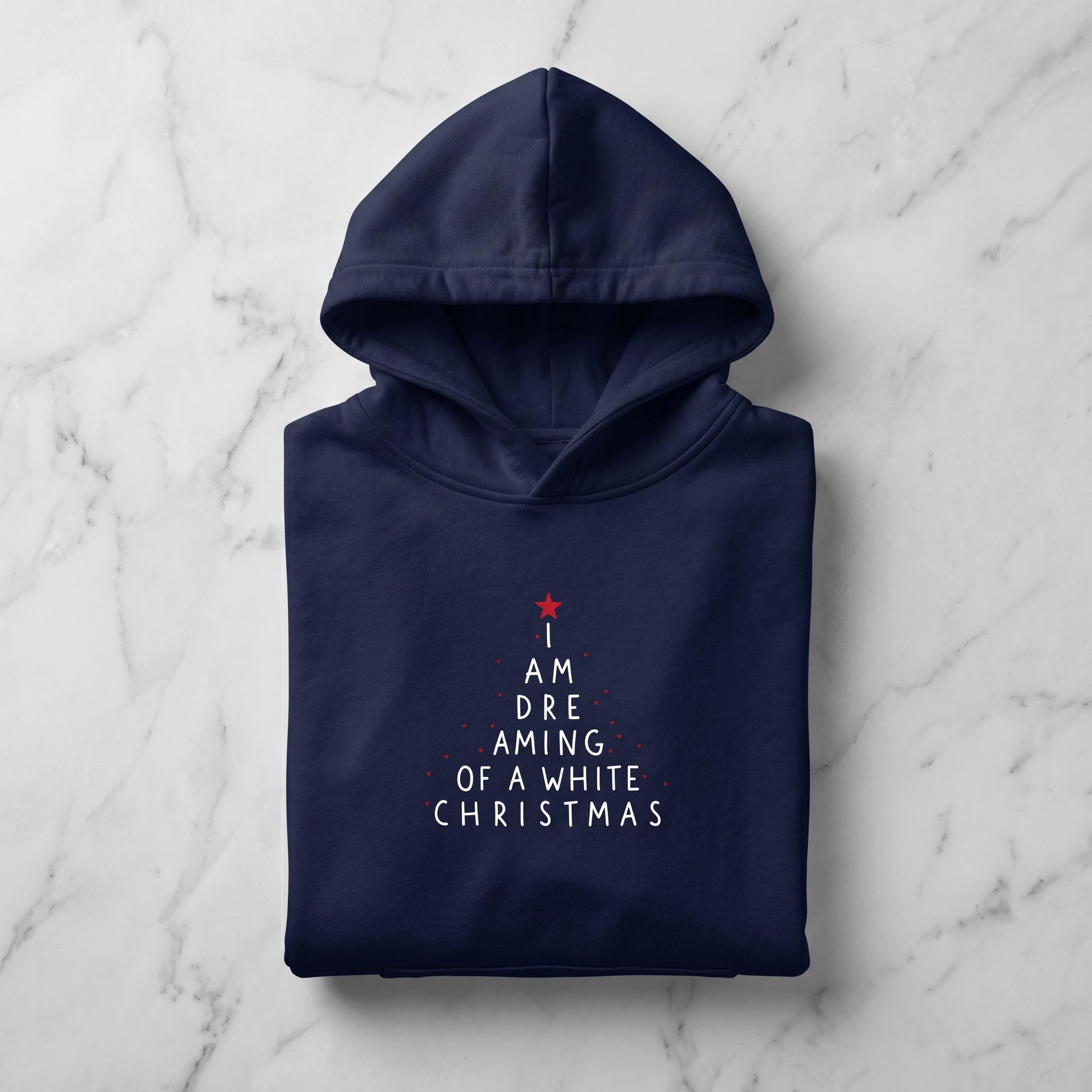 A navy blue hoodie with white text printed on it, laid out on a marble surface.