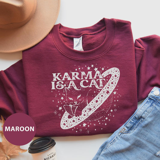 a t - shirt that says karma is a cat on it