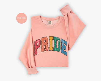 a pink sweatshirt with the word pride printed on it