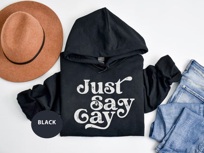 a black hoodie with the words just say gay on it