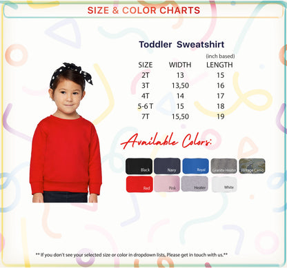 a young girl wearing a red sweater, with a size and color chart provided for the toddler sweatshirt.