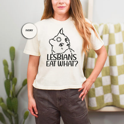 a woman standing in front of a mirror wearing a t - shirt that says lesbian