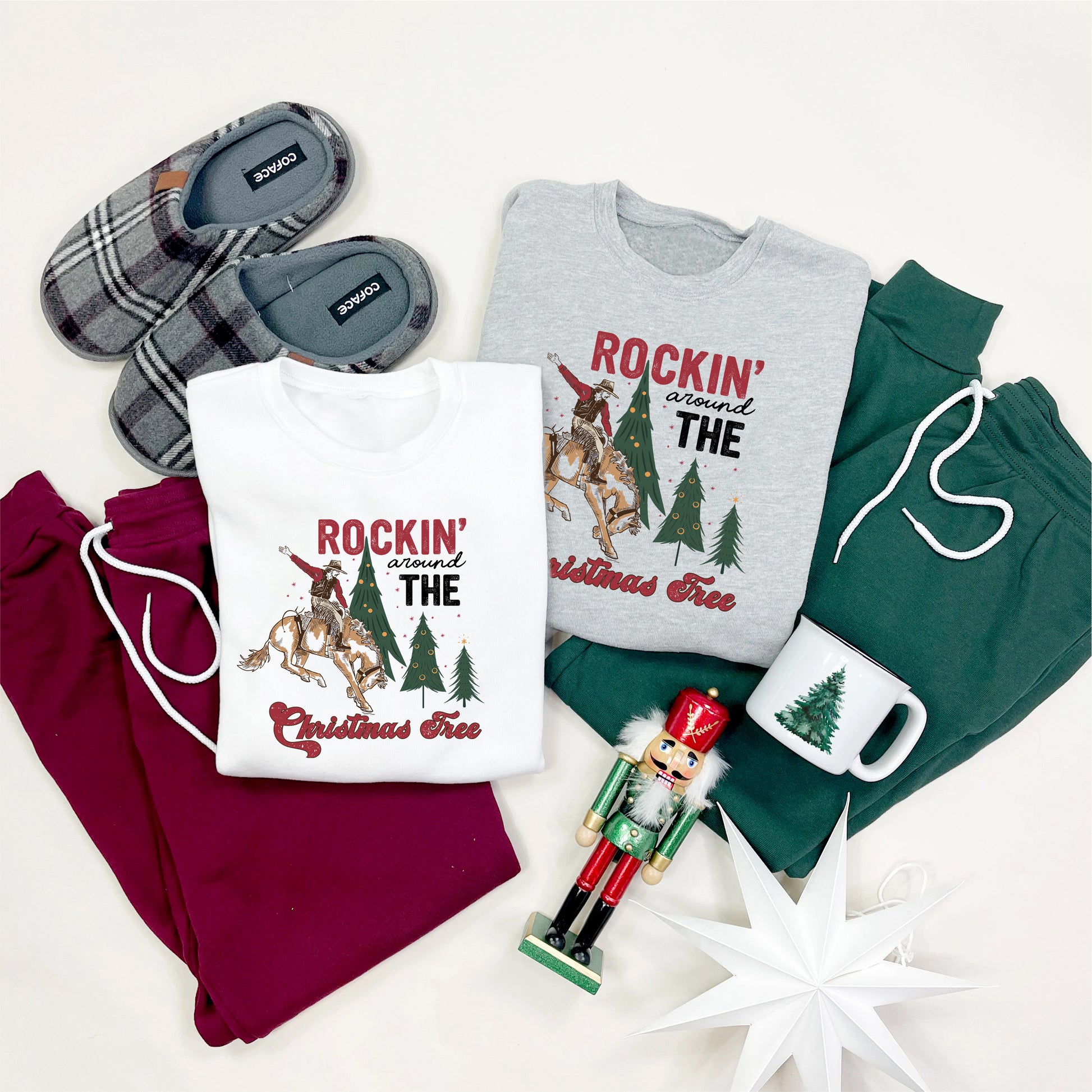 various Christmas-themed items, including two t-shirts, a pair of slippers, a nutcracker, a mug, and a star, all arranged on a white background.