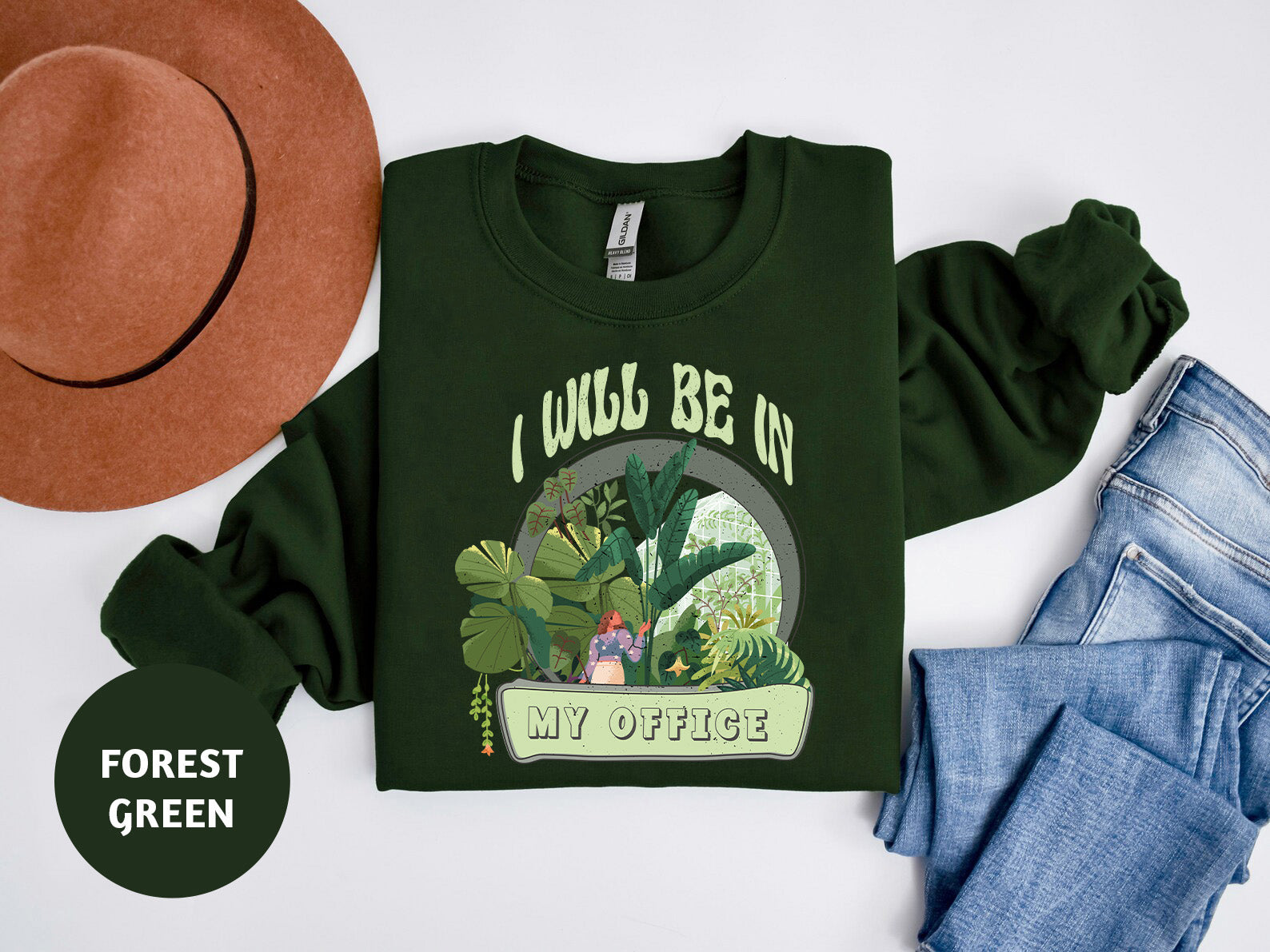 a green shirt with a picture of a cactus on it