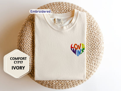 a t - shirt with the words love wins printed on it