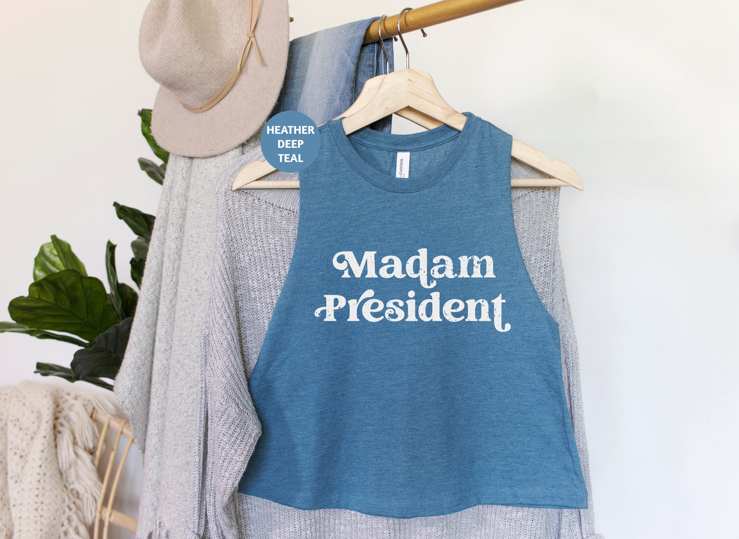 a blue shirt that says madam president hanging on a rack