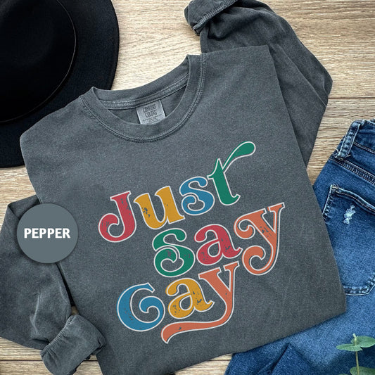 a t - shirt that says just sasy gay on it