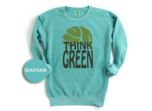 a green sweatshirt with the words think green printed on it